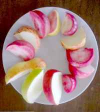 a selection of white and red fleshed apple slices